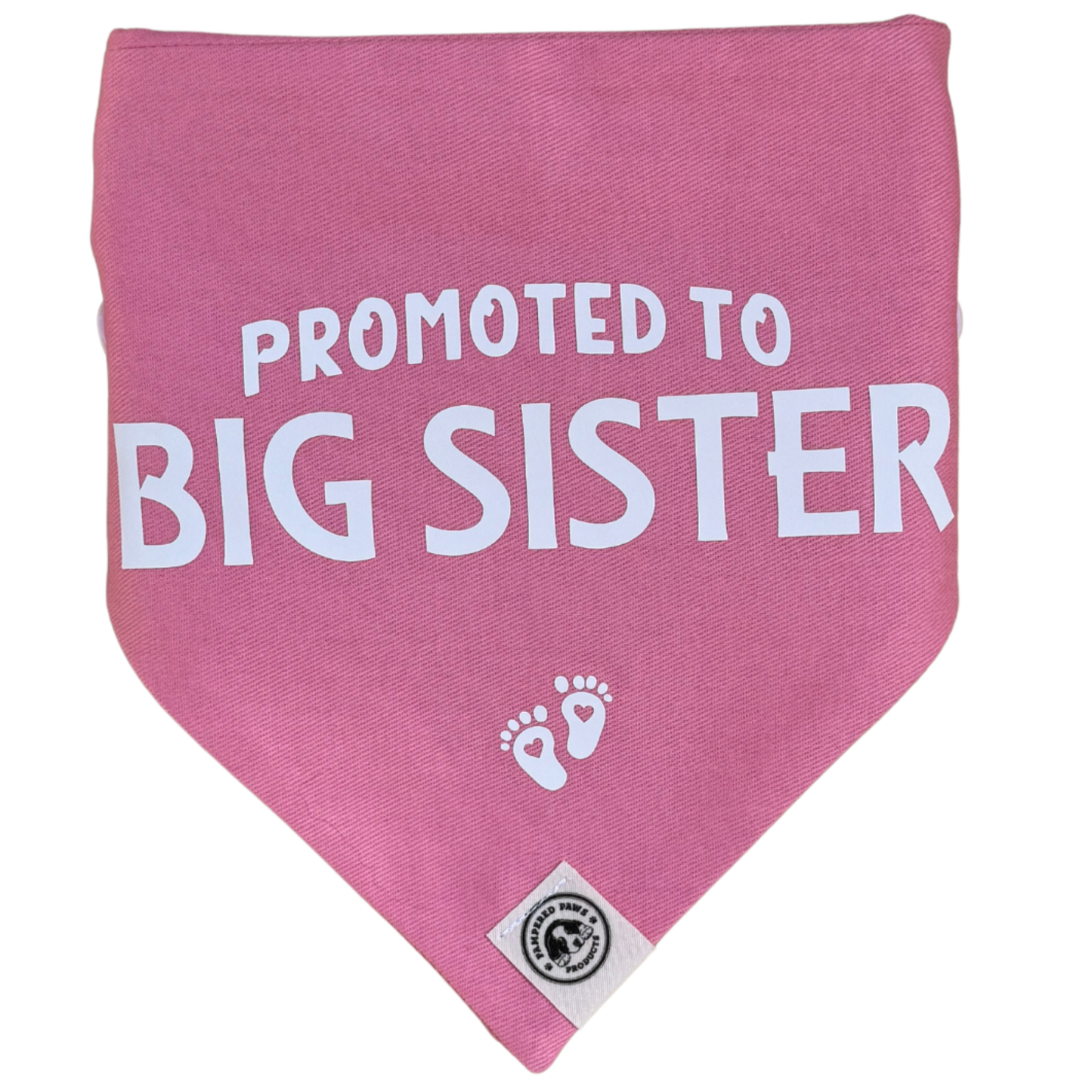 Close-up of pink “Promoted to Big Sister” dog bandana with baby feet print, announcement bandana for dogs
